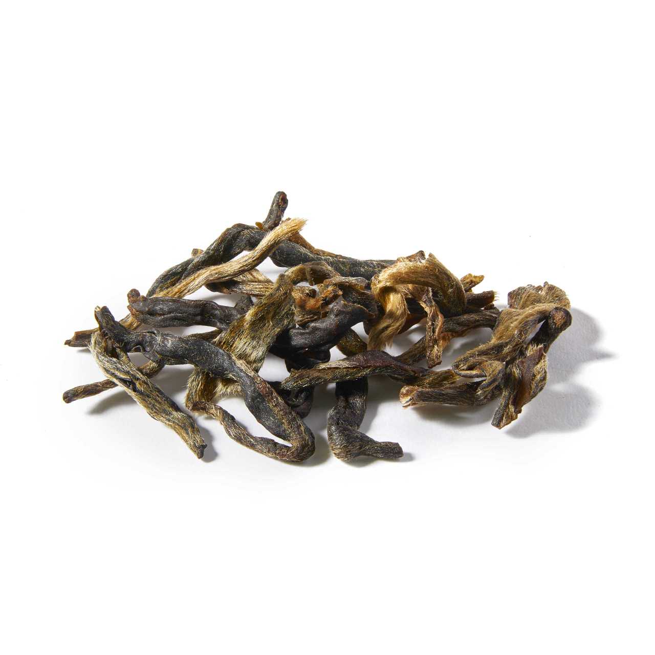 A macro pile of Raw Pu-Erh Cake Loose Leaf Tea