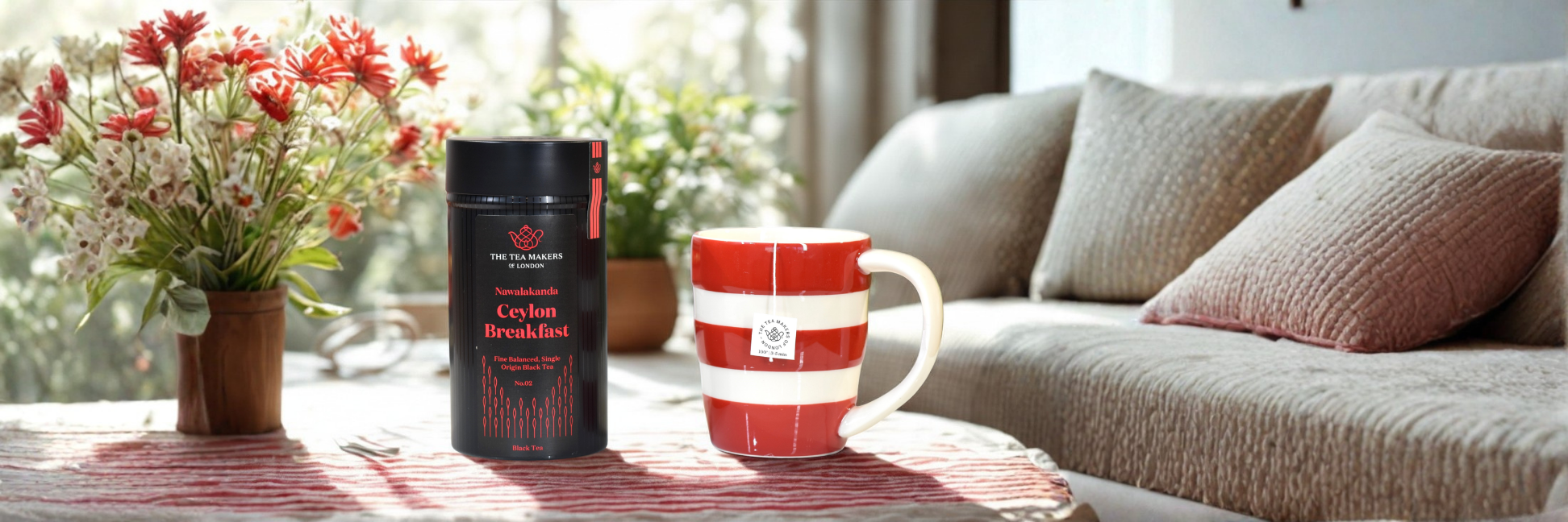 mug of ceylon breakfast tea in a living room with flowers on the table